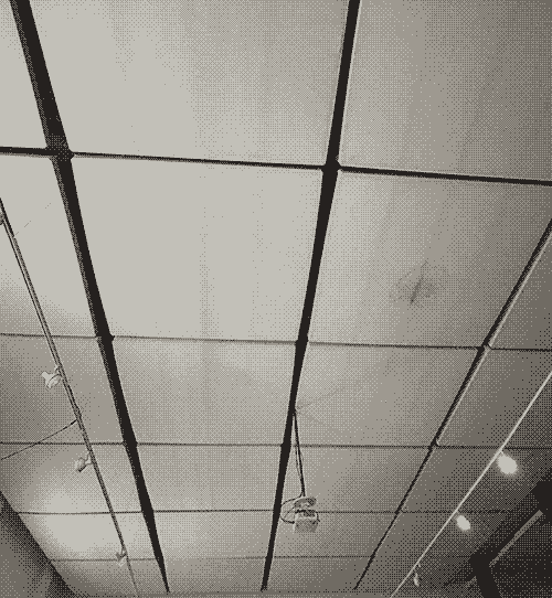 photo of the ceiling of The Lab, which is lined with square white panels that provide a better acoustic environment