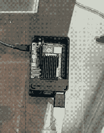 photograph of the server, which is housed in a clear plexi box