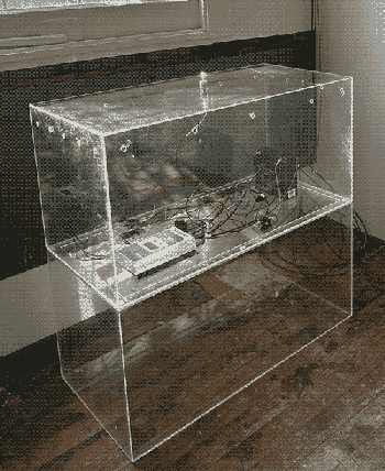photograph of the server, which is housed in a clear plexi box