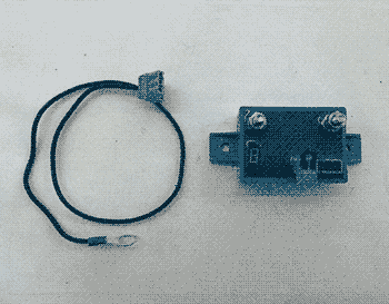 a black battery box connected to a small blue box with two wires